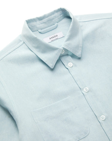 Light blue linen button-up shirt